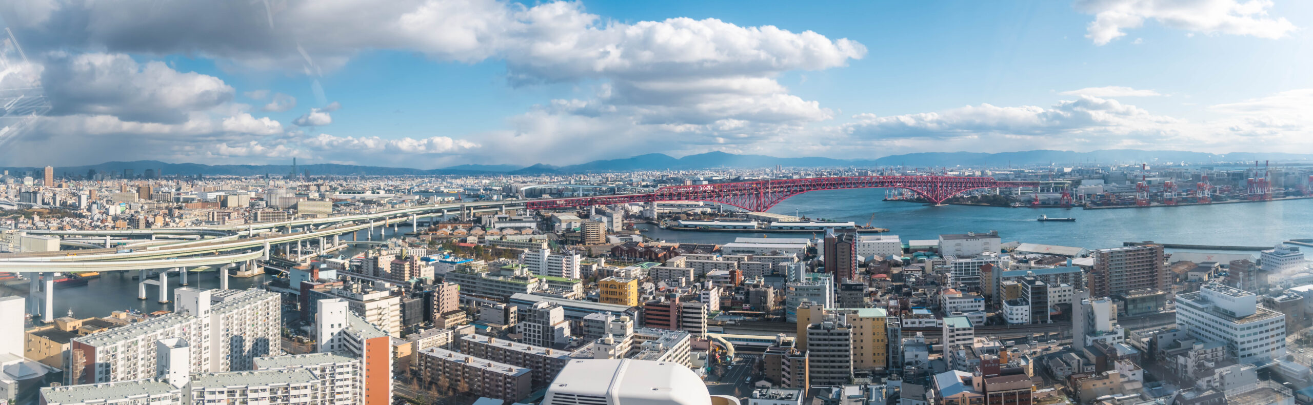 Panoramic aerial view of Osaka bay area with Minato bridge in Osaka, Japan